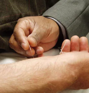 Needles inserting into a patients arm
